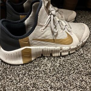 Women’s Nike Metcon White and Gold Athletic Shoes